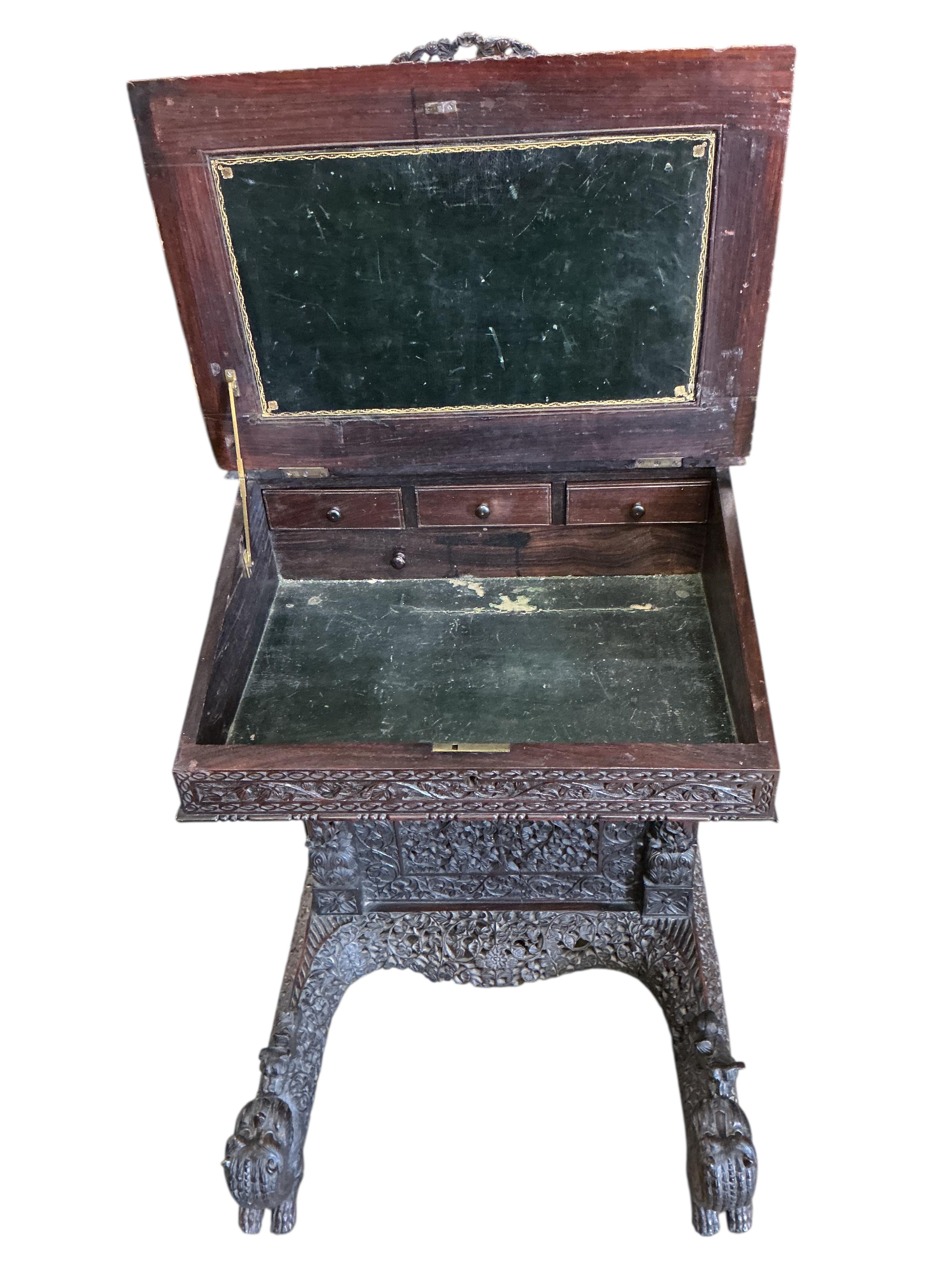A 19th century Burmese carved hardwood Davenport, width 65cm, depth 67cm, height 122cm
